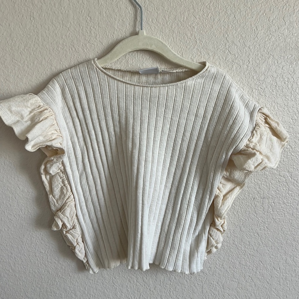 Ruffled sleeveless top